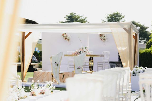 A white garden wedding setup